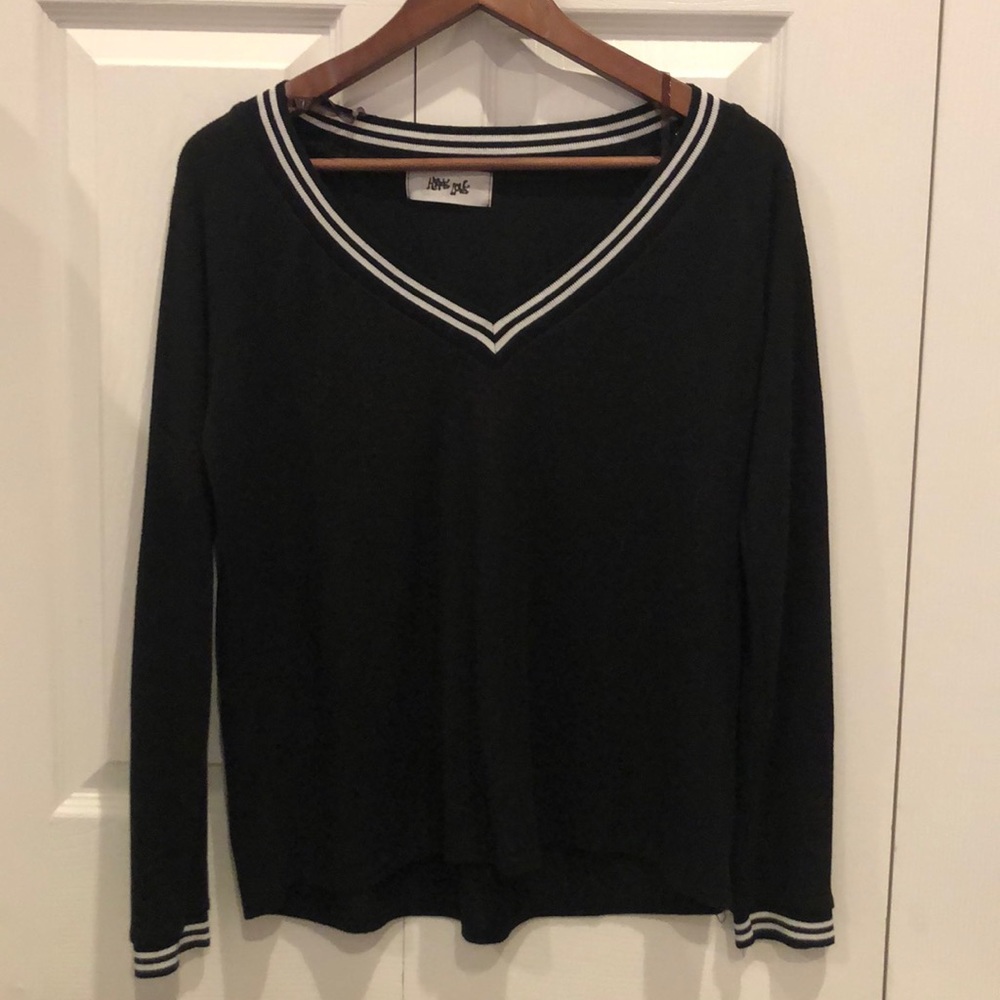 Black long sleeve with white boarded v-neck